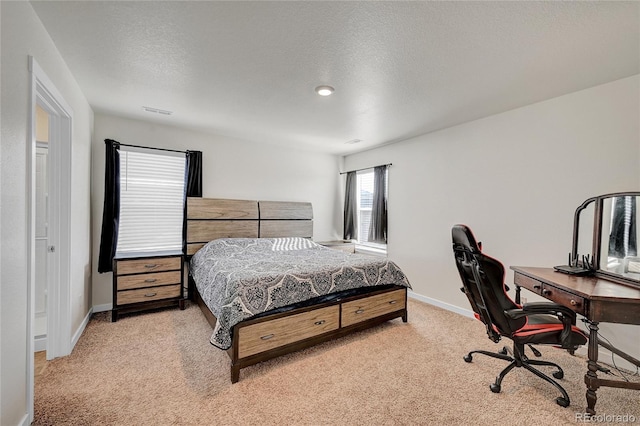 carpeted bedroom with a textured ceiling