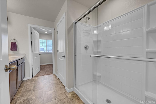 bathroom featuring vanity and an enclosed shower