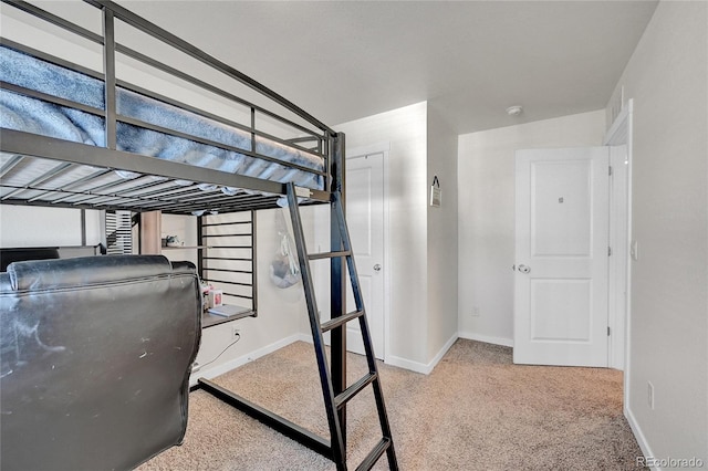 unfurnished bedroom featuring light carpet