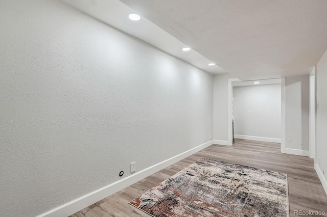 basement with wood-type flooring