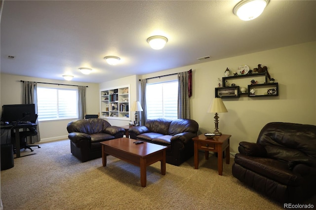 1128 S Duquesne Cir, Aurora, CO 80018 - living room with light carpet and an office area