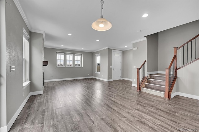 unfurnished living room with stairs, recessed lighting, baseboards, and wood finished floors