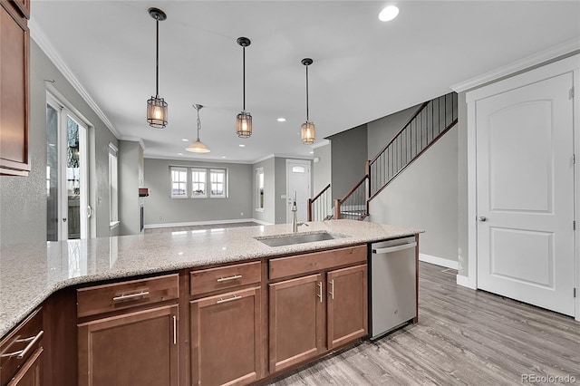 kitchen featuring dishwasher, light stone counters, crown molding, light wood-type flooring, and a sink