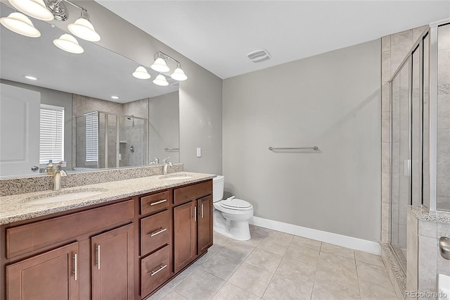 full bathroom featuring a stall shower, a sink, and baseboards