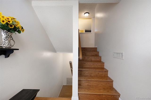 5082 Masheena Ln Unit 4, Colorado Springs, CO 80917 - staircase with a textured ceiling and wood finished floors