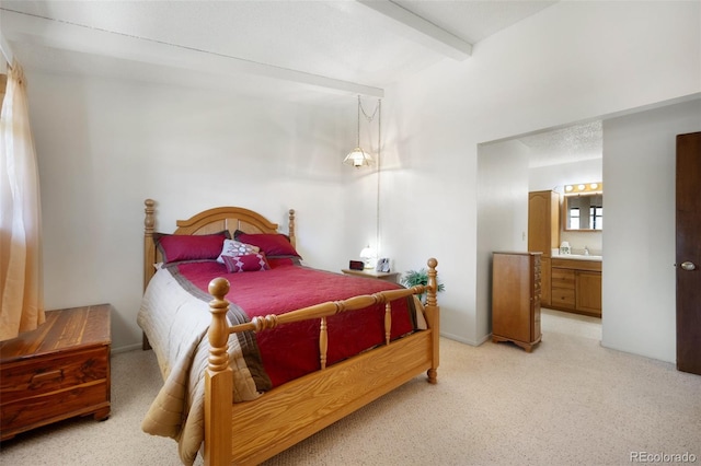 5082 Masheena Ln Unit 4, Colorado Springs, CO 80917 - bedroom with beamed ceiling, light carpet, connected bathroom, and a sink