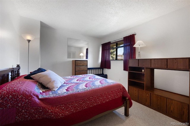 5082 Masheena Ln Unit 4, Colorado Springs, CO 80917 - carpeted bedroom featuring a textured ceiling