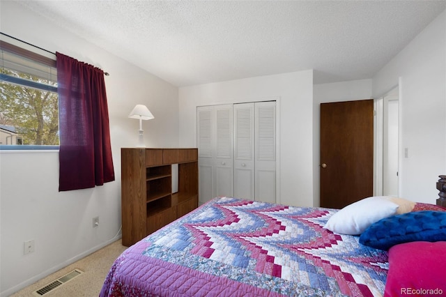 5082 Masheena Ln Unit 4, Colorado Springs, CO 80917 - carpeted bedroom with a closet, a textured ceiling, and baseboards