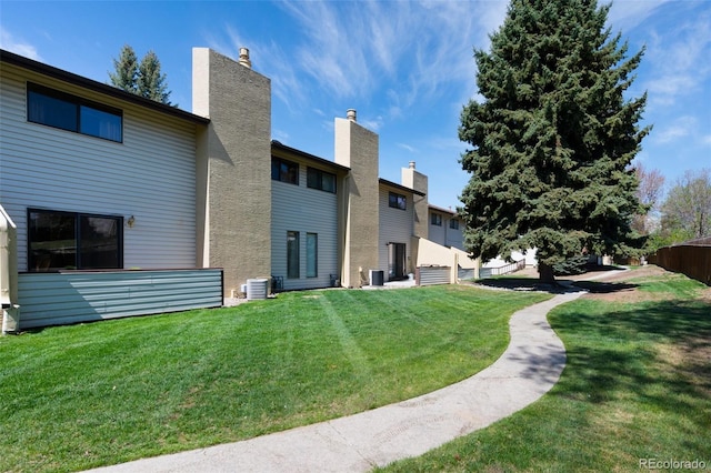 5082 Masheena Ln Unit 4, Colorado Springs, CO 80917 - back of property featuring central air condition unit and a chimney