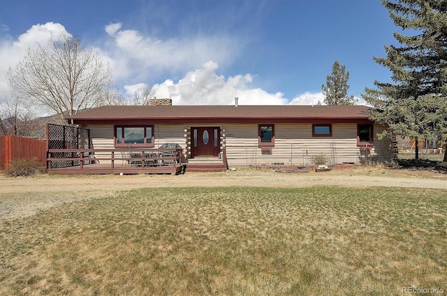 28453 County Road 337, Buena Vista, CO 81211 - single story home with a chimney, a front lawn, fence, and a deck