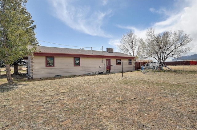 28453 County Road 337, Buena Vista, CO 81211 - back of property featuring log exterior, fence, and a chimney