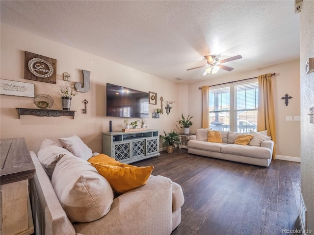 living room with ceiling fan, a textured ceiling, and dark hardwood / wood-style flooring