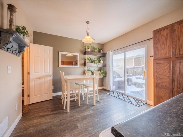 dining room featuring dark wood-type flooring