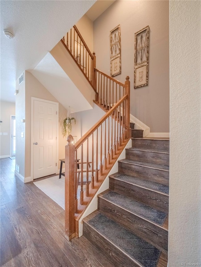 stairway with wood-type flooring