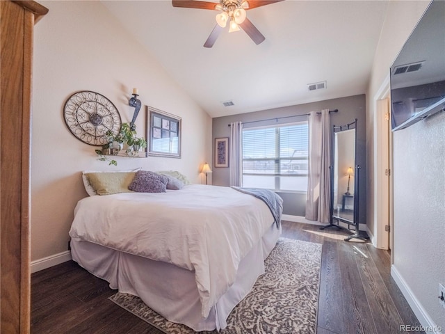 bedroom with lofted ceiling, dark wood-type flooring, and ceiling fan