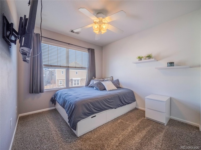 bedroom featuring ceiling fan and dark carpet