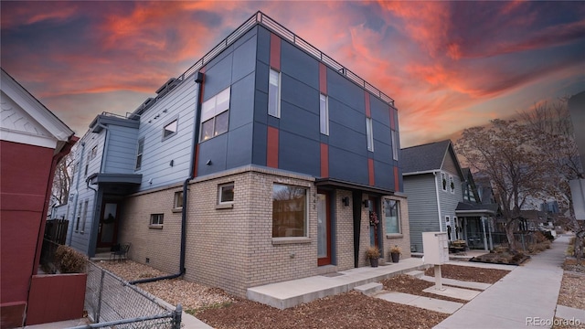 view of property exterior at dusk