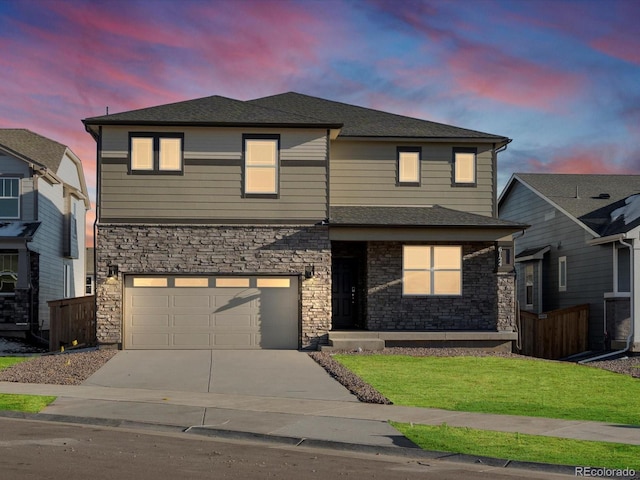 view of front facade featuring a lawn and a garage