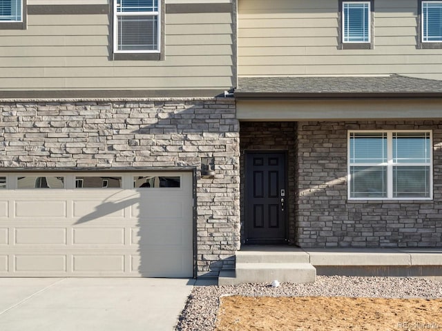 doorway to property featuring a garage