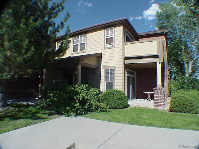 8915 Federal Blvd Unit 104, Westminster, CO 80260 - rear view of property with a balcony and brick siding