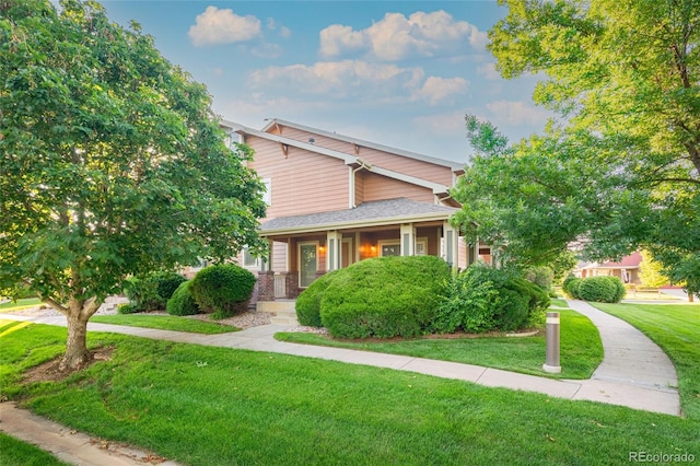 135 Carina Cir Unit 104, Loveland, CO 80537 - view of front of property with a front yard and a porch