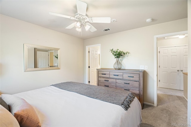 135 Carina Cir Unit 104, Loveland, CO 80537 - bedroom with light carpet and ceiling fan