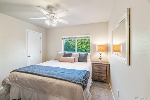 135 Carina Cir Unit 104, Loveland, CO 80537 - carpeted bedroom featuring baseboards and a ceiling fan