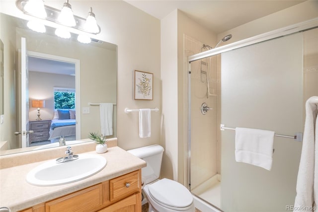135 Carina Cir Unit 104, Loveland, CO 80537 - bathroom featuring connected bathroom, vanity, and a shower stall
