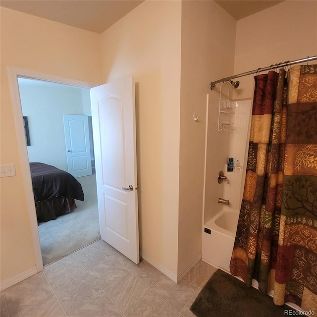 bathroom featuring tile patterned floors and shower / bath combo