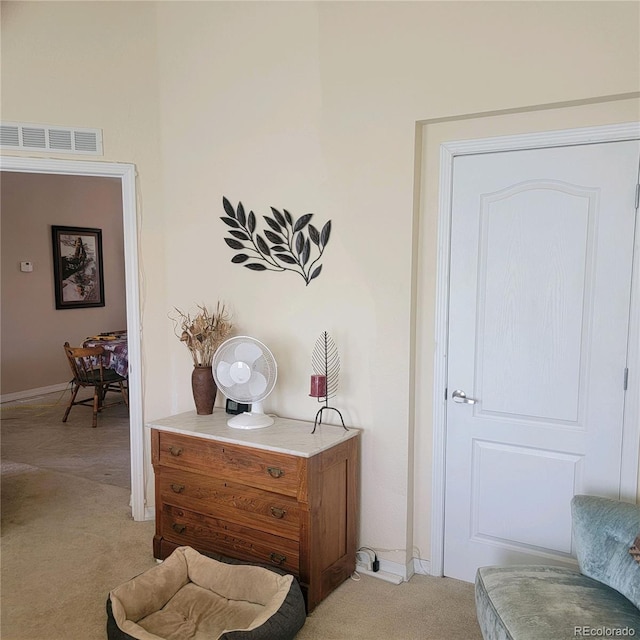 interior space featuring light colored carpet