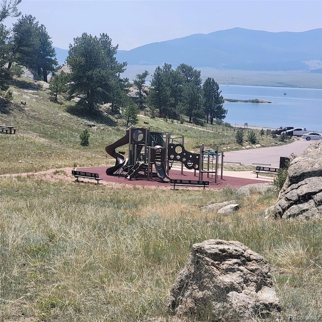 view of jungle gym with a mountain view