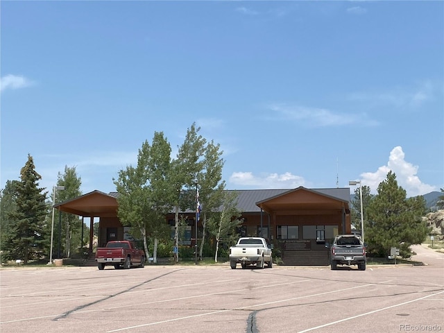 view of parking / parking lot with a carport