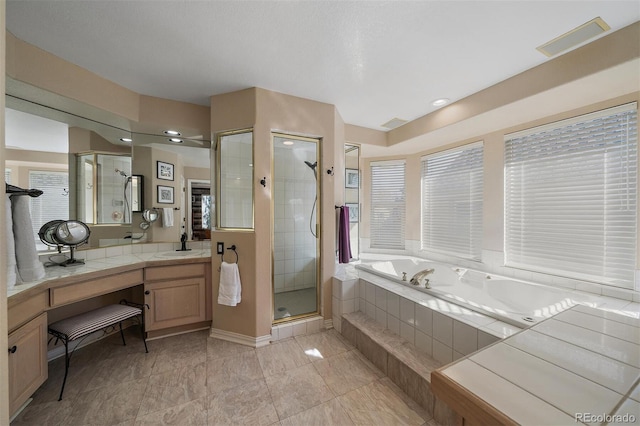 bathroom featuring visible vents, a shower stall, vanity, and a bath