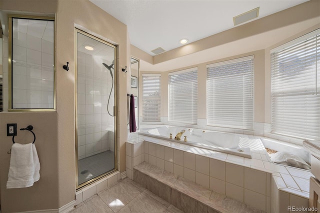 full bathroom with a stall shower, visible vents, and a bath