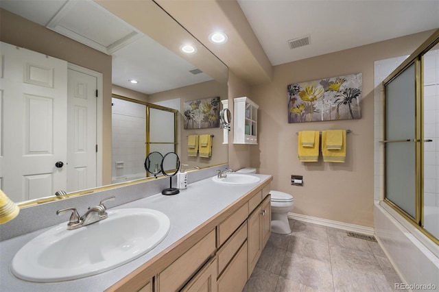 full bathroom featuring visible vents, a sink, toilet, and double vanity