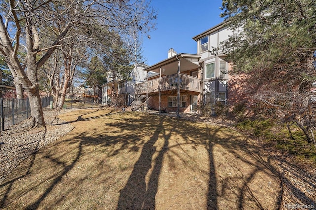 view of yard with fence and a wooden deck