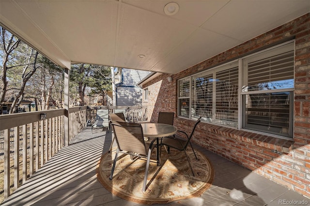 wooden terrace featuring outdoor dining space