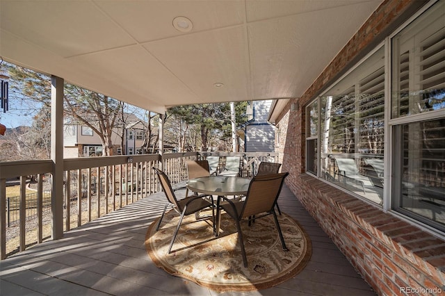 wooden deck with outdoor dining area