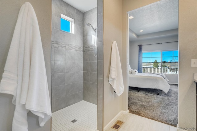 bathroom featuring tiled shower