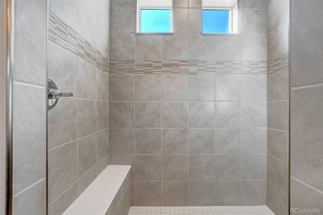 bathroom with a tile shower