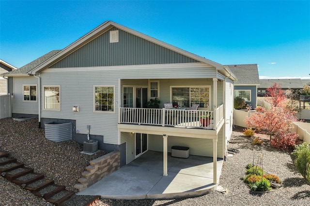 rear view of property featuring a patio area