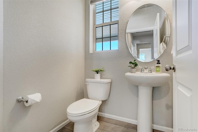 bathroom featuring tile patterned flooring and toilet