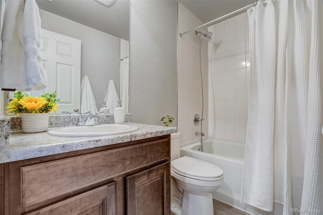 full bathroom with shower / bath combo, toilet, and vanity