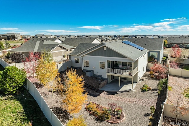 back of property featuring cooling unit and a patio