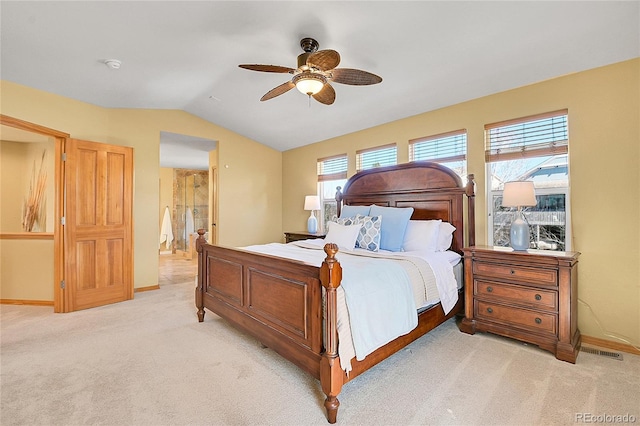 bedroom featuring baseboards, light carpet, a ceiling fan, and vaulted ceiling