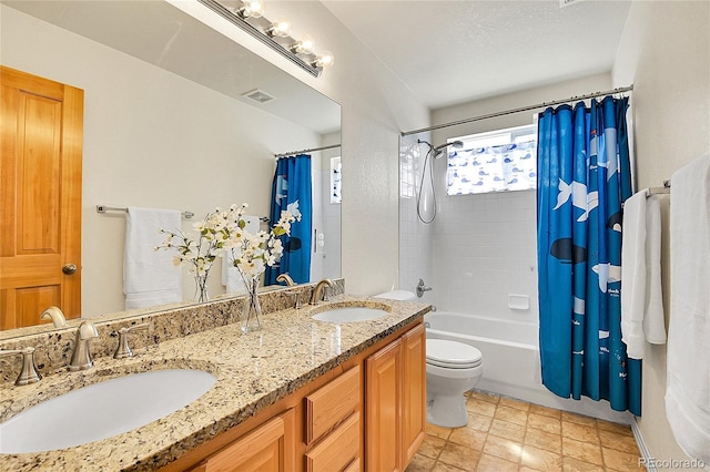 bathroom featuring a sink, visible vents, shower / bath combo, and double vanity