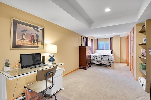 office area featuring a raised ceiling, recessed lighting, baseboards, and light carpet