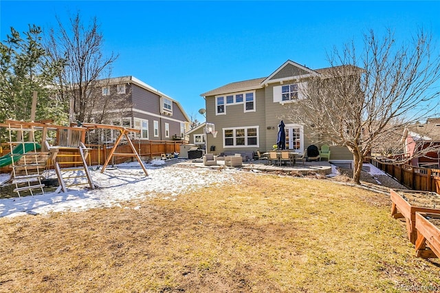 back of house featuring a patio area, fence private yard, french doors, and a playground