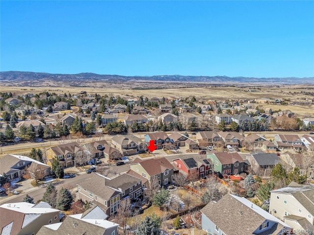 drone / aerial view featuring a mountain view and a residential view