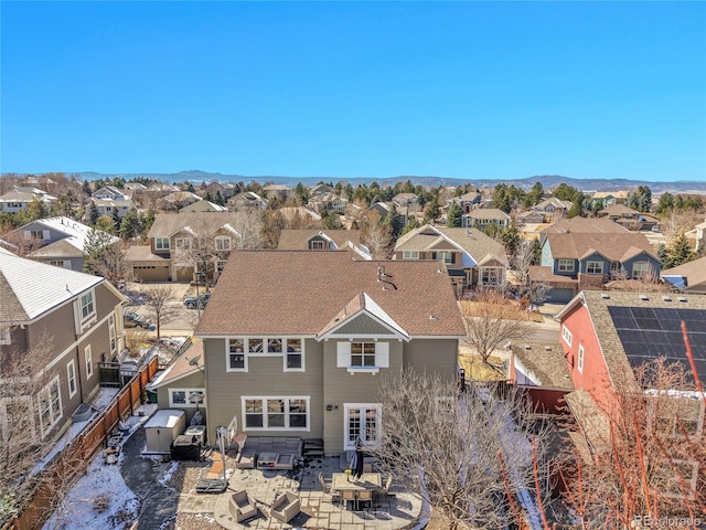 drone / aerial view featuring a mountain view and a residential view